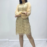 فستان سهرة قصير ذهبي اللون مرصع بالترتر